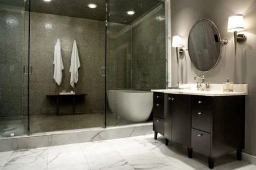 A large bathroom with a vanity, shower and tub