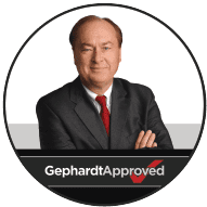 A confident man in a suit and red tie stands with arms crossed above a "Gephardt Approved" banner, symbolizing trusted 24/7 home services.