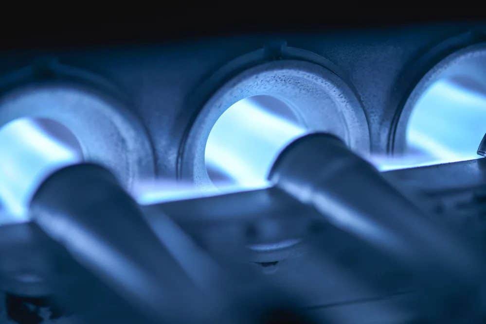 Close-up of steady blue flames in a gas furnace, reflecting Black Diamond Experts’ reliable, 24/7 home comfort service in Utah.