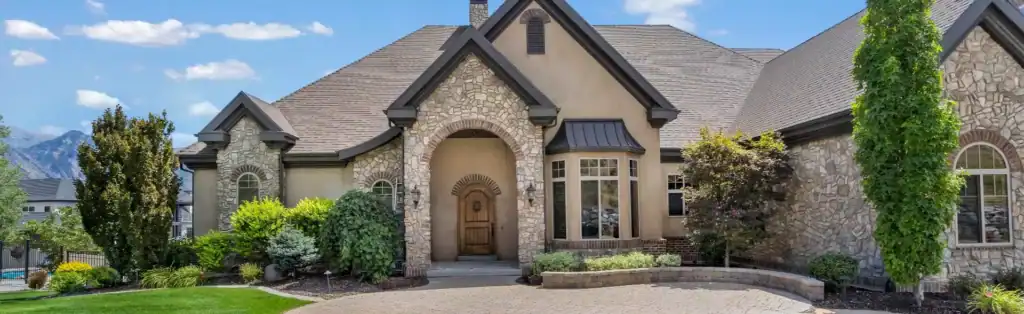 Beautiful stone and stucco home in Utah, cared for by Black Diamond Experts—your trusted 24/7 plumbing, HVAC, and electrical team.